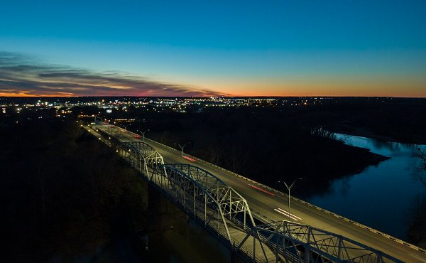 Aerial view of the Colorado River bridges at Bastrop, TX, with the Lost Pines woodland the 78602 area is known for