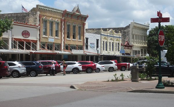Historic limestone and brick storefronts on the Victorian courthouse square in Georgetown, TX, the centerpiece of the 78626 market